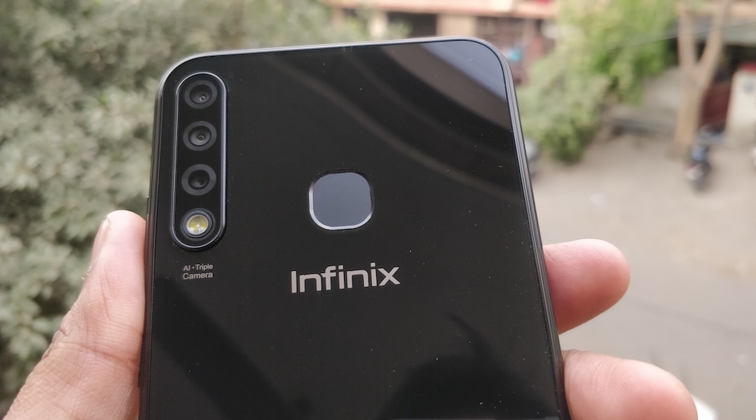 Infinix Smart 3 Plus (X627V) is a feature-packed entry-level budget mobile phone, it has a triple rear camera, 6.21 inches HD+ display, MediaTek A22 Quad Core 2.0GHz processor and 3500 mAh Li-ion Polymer Battery. If I am not wrong then Infinix Smart 3 Plus (X627V) is the only mobile phone in the price range of Rs. 7k which comes with the three rear camera lens setup. Infinix has launched the Smart 3 Plus in a segment which is the most crowded mobile phone segment in India. In sub 10k segment there are too many phones probably more than any other segment, I shouldn't be surprised if I visited offline mobile phone store and came to know about few mobile phone brands which I never heard before. There are many companies and many brands in the sub 10k segment specially in offline mobile phone market which are launching the devices on a regular basis and also people are actually buying it based on the recommendation of store's salesperson. Infinix is an online-only brand of Transsion Holding and other brands of the company are TECNO and iTel. Infinix Smart 3 Plus is going to be available online only and it will the direct combat with the entry-level Xiaomi Redmi and Realme phones. Xiaomi Redmi phones and Realme C series phones are doing really well in this sub 10k segment in India but Infinix Smart 3 Plus is going to play a challenging role in the battle. Let's take look at the key specification of Infinix Smart 3 Plus (X627V). <h2>Key Specifications of Infinix Smart 3 Plus (X627V):</h2> <table id="tablepress-1572" class="tablepress tablepress-id-1572 tablepress-responsive-phone" width="679"> <thead> <tr class="row-1 odd"> <th class="column-1"></th> <th class="column-2"> <h5><span style="color: #ffffff;">Infinix Smart 3 Plus (X627V)</span></h5> </th> </tr> </thead> <tbody class="row-hover"> <tr class="row-2 even"> <td class="column-1"><strong> Display</strong></td> <td class="column-2"> <ul> <li>6.2-inch HD+ IPS LCD</li> <li>720 x 1520 resolution</li> <li>19:9 aspect ratio</li> <li>~269 PPI</li> <li>88% screen-to-body ratio</li> <li>Waterdrop display notch</li> </ul> </td> </tr> <tr class="row-3 odd"> <td class="column-1"><strong>Processor</strong></td> <td class="column-2"> <ul> <li>MediaTek MT6761 Helio A22 (12 nm)</li> <li>Quad-core 2.0 GHz Cortex-A53</li> </ul> </td> </tr> <tr class="row-4 even"> <td class="column-1"><strong>GPU</strong></td> <td class="column-2"> <ul> <li>PowerVR GE8320</li> </ul> </td> </tr> <tr class="row-5 odd"> <td class="column-1"><strong>RAM</strong></td> <td class="column-2"> <ul> <li>2GB</li> </ul> </td> </tr> <tr class="row-6 even"> <td class="column-1"><strong>Storage</strong></td> <td class="column-2"> <ul> <li>32GB</li> <li>Expandable up to 256 GB; Dedicated MicroSD card slot</li> </ul> </td> </tr> <tr class="row-7 odd"> <td class="column-1"><strong>Primary Camera</strong></td> <td class="column-2"> <ul> <li>AI Triple Camera</li> <li>13MP (f/1.8) + 2MP + Low Light Sensor</li> <li>PDAF, AR Stickers, AI Portrait, HDR, Night Mode, Beauty Mode</li> <li>Dual LED Flash</li> <li>1080p@30fps video recording</li> </ul> </td> </tr> <tr class="row-8 even"> <td class="column-1"><strong>Selfie Camera</strong></td> <td class="column-2"> <ul> <li>8MP, f/2.0</li> <li>AR Stickers, Beauty, Portrait, HDR</li> <li>Screen Flash</li> </ul> </td> </tr> <tr class="row-9 odd"> <td class="column-1"><strong>Battery</strong></td> <td class="column-2"> <ul> <li>3,500mAh, Non-removable Li-Po</li> </ul> </td> </tr> <tr class="row-10 even"> <td class="column-1"><strong>Audio </strong></td> <td class="column-2"> <ul> <li>3.5mm Audio Jack</li> <li>Speakers</li> </ul> </td> </tr> <tr class="row-11 odd"> <td class="column-1"><strong>Connectivity</strong></td> <td class="column-2"> <ul> <li>Dual Nano SIM, 4G VoLTE</li> <li>Bluetooth 5.0, Wi-Fi, Hotspot, GPS, FM Radio</li> <li>3.5mm jack, microUSB 2.0, USB On-The-Go,</li> </ul> </td> </tr> <tr class="row-12 even"> <td class="column-1"><strong>Sensors</strong></td> <td class="column-2"> <ul> <li>Fingerprint sensor - Rear Mounted</li> <li>G-sensor, Proximity Sensor, Light Sensor, Compass</li> </ul> </td> </tr> <tr class="row-13 odd"> <td class="column-1"><strong>Dimensions and weight</strong></td> <td class="column-2"> <ul> <li>6.18 x 2.99 x 0.31 inches</li> <li>148g</li> </ul> </td> </tr> <tr class="row-14 even"> <td class="column-1"><strong>Colour</strong></td> <td class="column-2"> <ul> <li>Midnight Black, Sapphire Cyan</li> </ul> </td> </tr> <tr class="row-15 odd"> <td class="column-1"><strong>Software</strong></td> <td class="column-2"> <ul> <li>XOS Cheetah 5.0 skin on Android 9 Pie</li> </ul> </td> </tr> <tr class="row-16 even"> <td class="column-1"><strong>Price</strong></td> <td class="column-2">—</td> </tr> <tr class="row-17 odd"> <td class="column-1"><strong>Box Contents</strong></td> <td class="column-2"> <ul> <li>Infinix Smart 3 Plus Handset</li> <li>Adapter, USB Cable</li> <li>TPU Case, SIM Ejector Pin</li> <li>Protective Screen Guard</li> <li>Quick Switch Adapter</li> <li>Quick Start Guide</li> </ul> </td> </tr> </tbody> </table> <h2>Design and Display of Infinix Smart 3 Plus:</h2> Infinix Smart 3 Plus is a low budget phone but its design and finishing are impressive. It has a plastic body and glass on the front, the rear plastic panel has glossy finishing which is giving it a shiny and glass-like look and feels but unfortunately it is also a fingerprint magnet. The triple rear camera is vertically placed on the rear side at the left top corner followed by the dual LED flash right below the Triple lenses setup. Apart from the camera setup, the fingerprint scanner is also mounted on the rear side, the Infinix branding is right below the fingerprint sensor and a couple of more texts on the bottom of the rear panel.   The volume rocker and the power button is on the right side of the phone, on left, it has the dual SIM + MicroSD card slot in the same tray. At the bottom, it has speaker grille, Micro USB port, microphone and 3.5mm audio jack; there isn't anything on the top portion. The 6.2 inches HD+ display panel is on the front with very minimal bezels, the top of the display has the trending waterdrop notch for the selfie camera and sensors. The earpiece is at the right above selfie camera near the top edge of the display panel. The full HD display is very common these days even in the budget segment but Infinix still trusted on the HD+ screen for Infinix Smart 3 Plus. Not very sure about the display panel manufacturer but liked the display, it seems like Infinix has done some really cool software tweak for the display. However, the company has no other option but using the HD display since the MediaTek MT6761 Helio A22 doesn't support the full HD display. I have found the brightness and colour reproduction satisfying considering its price segment. <h3>Performance Review of Infinix Smart 3 Plus:</h3> Infinix Smart 3 Plus is powered by the MediaTek MT6761 Helio A22 SoC which is a Quad-core 2.0 GHz Cortex-A53 processor, the variant I have been reviewing is having 2GB RAM and 32GB internal storage this is also the only RAM variant launched by the company so far. Hardware is not the only factor which influences the performance, software plays an important and very crucial role in the overall performance of any mobile phone. It has the company's latest custom UI skin called XOS Cheetah 5.0.0 on Android Pie, the operating system is os much customised that you won't even get a glimpse of the stock android and yes it has the bloatware too, but fortunately, most of the preinstalled apps can be uninstalled. There are some official applications that you can not remove or uninstall from the system which is bad for the phone with such limited resources. The overall performance of the phone is just average, its not very smooth in performance there are some minor lags while doing multitasking but if you are not into the super multitasking then it should work fine for you. The performance is like any other mobile phone in the price range of under 7-8k. The performances of phones under this price segment including the Infinix Smart 3 Plus are good until you compare this with the flagship phones that most of the reviewers are using. These phones would be mostly the first full-fledged smartphone for its potential buyers or some of the buyers will be also buying it as a secondary phone not to use as a daily driver. The first time users who have not been using a flagship phone may not even notice the lags, considering its target buyers, price, and specs its good phone to enjoy the Video Streamings, watching YouTube on its big and bright display, playing some regular games and other regular uses like browsing, making phone calls etc. The fingerprint sensor is working just fine, sometimes it's taking a bit longer to unlock the device but mostly able to unlock quickly. If you do not want to use the fingerprint sensor then the Face Unlock feature is also there. XOS Cheetah 5.0.0 comes with a feature called AIBox to block the unnecessary notification from appearing, I find it very irritating because there I am not able to find a way to remove this from the notification area, not even after disabling its functionality. <img class="alignnone wp-image-9366" src=infinix-smart-3-plus-review-triple-rear-camera-and-big-display-at-just-inr-6999-camera-review-techinfobit-.html alt="Infinix Smart 3 Plus Review - Triple Rear Camera and Big Display at Just INR 6,999-Camera Review-techinfoBiT" width="319" height="323" /><img class="alignnone wp-image-9367" src=infinix-smart-3-plus-review-triple-rear-camera-and-big-display-at-just-inr-6999-camera-review-techinfobit-1.html alt="Infinix Smart 3 Plus Review - Triple Rear Camera and Big Display at Just INR 6,999-Camera Review-techinfoBiT" width="314" height="324" /> Battery and camera play an important role in making a decision to buy some specific budget phone, will discuss the camera later, let's talk about the battery. The battery backup of Infinix Smart 3 Plus is very good, it has a 3500mAh battery which takes 1 hour 30-45 minutes to charge the phone from 0 to 100 per cent. On a regular day to day uses it may last more than one and a half day easily and 6-8 hours on heavy uses like playing games and streaming videos etc. <img class="wp-image-9368 aligncenter" src=infinix-smart-3-plus-review-triple-rear-camera-and-big-display-at-just-inr-6999-camera-review-techinfobit-1-1.html alt="Infinix Smart 3 Plus Review - Triple Rear Camera and Big Display at Just INR 6,999-Camera Review-techinfoBiT" width="388" height="819" /> <h2>Camera Review of Infinix Smart 3 Plus:</h2> The camera is the price focus of this phone and as I said for the obvious reason it plays an important role in making the decision to buy any phone. Infinix Smart 3 Plus has the Triple Camera Setup (13MP (f/1.8) + 2MP + Low Light Sensor) for the rear camera and 8MP, f/2.0 camera for selfie. As I've mentioned earlier in this post this might be the only mobile phone in its price range to feature the Triple rear camera. Both rear and front camera of the phone is good enough to take photos that social media ready. The focus speed of the rear camera is pretty quick, it also has an option to adjust the brightness before taking the photo from the rear camera but it is not in sync with the toggle and not working smoothly. There are many camera modes like AI Portrait, HDR, Night Mode, Beauty Mode. The photo capturing speed in any mode is fast but it's taking around 1-2 seconds of time to show the preview of the images. The camera app of the phone definitely use some software updates to run more smoothly and effortlessly. I appreciate the picture quality from both selfie and primary camera. Photos from both cameras are coming good in the daylight conditions, good enough to share on social media sites, You won’t get many details though. During the low light conditions, both cameras are capturing too much noise, for a rear camera, it's slightly manageable with the Night mode but not for the front camera not even using the screen flash. the colors on the photos appearing good with a balanced contrast, but the camera performance is not the same in the low light conditions. (All photos are in low resolution and optimised, click on photos to open the originals) Rear Camera Samples: Selfie Samples: <h3>Verdict:</h3> the overall design, performance, battery and camera of the Infinix Smart 3 Plus is impressive considering the fact that you are getting all these for just Rs, 6,999. You can consider buying this phone if you are looking for an entry-level mobile phone and big display, camera, and the battery is your priority. Similar options in this price segment that I recommend is the Realme C1. If you can stretch your budget then there are also some other good options like Redmi 7, Redmi Note 7, Honor 9N, Honor 7A etc. You can get this phone now from Flipkart at a price of Rs. 6,999.